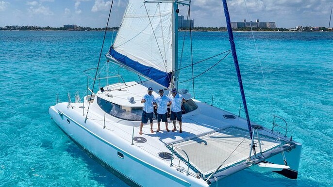 Isla Mujeres Catamaran Tour with hotel Pick up, Snorkeling and Beach Club